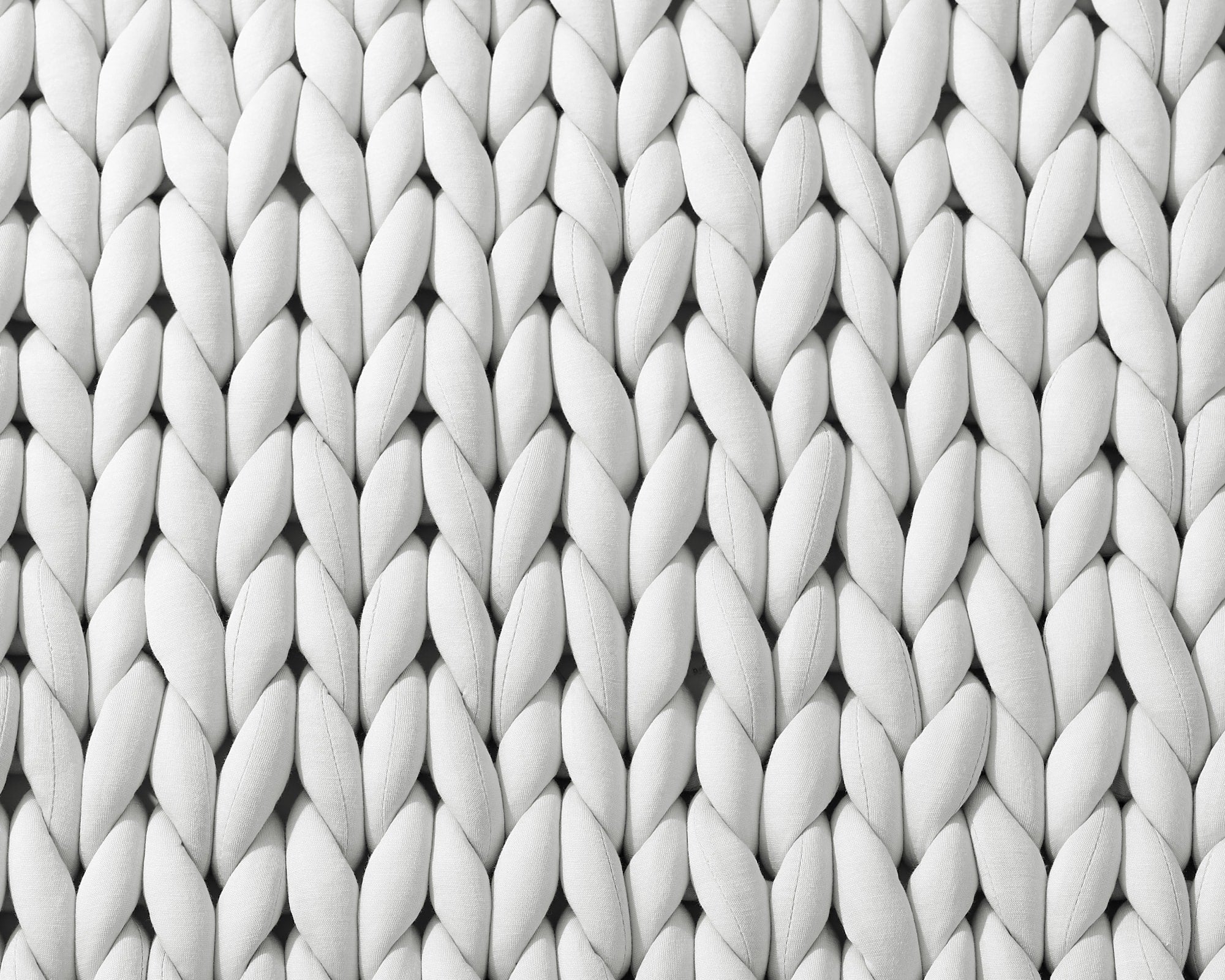 Closeup on the texture of the Soft Grey Gravity Weighted Chunky Knit Blanket - #color_soft-grey