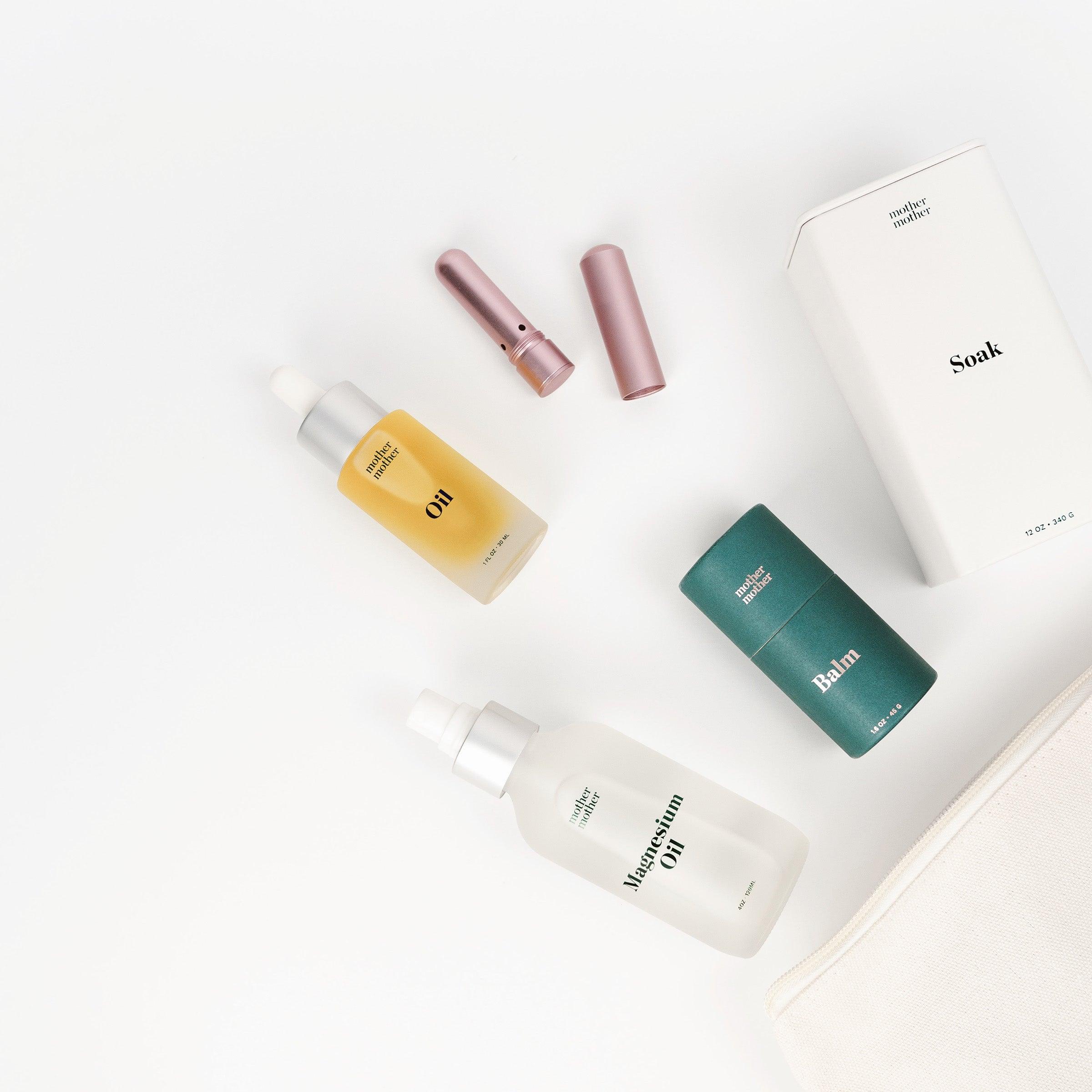 self care bundle: belly oil, magnesium il and soak, belly balm, aromatherapy inhaler on a white background