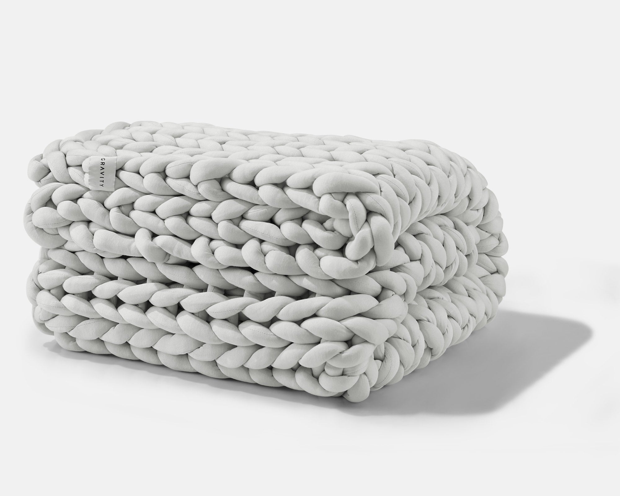 A folded Soft Grey Gravity Weighted Chunky Knit Blanket - #color_soft-grey